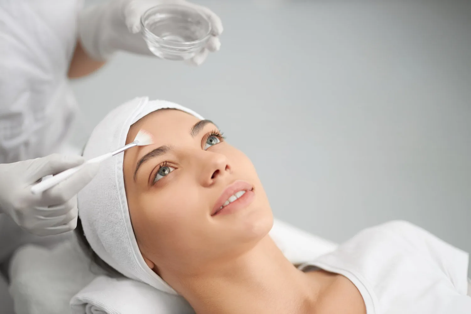 medical dermatology woman young-woman-doing-procedure-face-beautician-chemical-peel